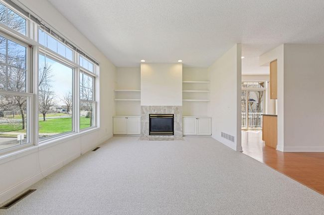 Beautiful living room with oversized picture windows | Image 9