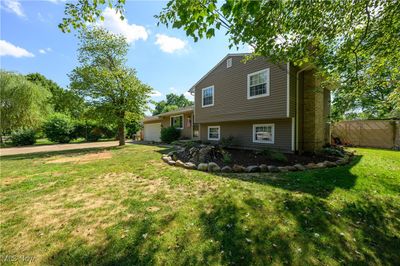 Rear view of house with a yard | Image 2