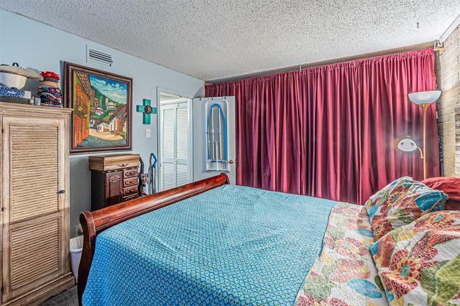 Bedroom featuring a textured ceiling | Image 11