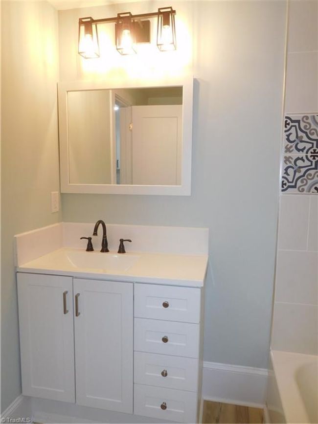 MAIN LEVEL HALL FULL BATHROOM. | Image 16