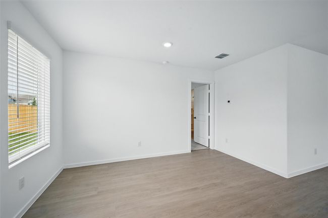 Spare room with wood finished floors and recessed lighting | Image 11