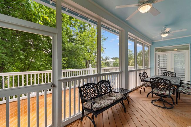 Sunroom featuring ceiling fan and outdoor dining space | Image 30