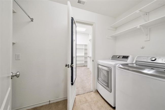 At the center of the home is the conveniently located laundry room. | Image 24
