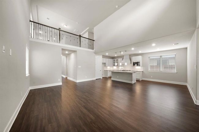 This home has a true open floor plan with the living room, kitchen, and breakfast area all being open to eachother. | Image 5