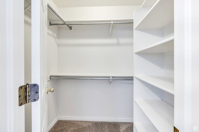 Spacious closet with carpet floors | Image 10