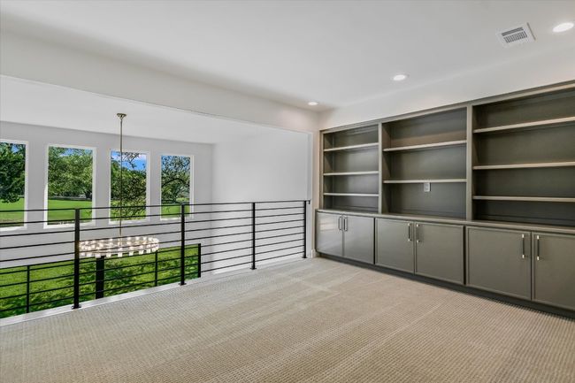 Second upstairs living area with built in shelving. | Image 7