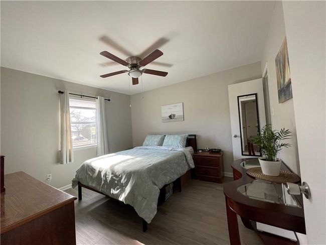 Washroom featuring separate washer and dryer and a textured ceiling | Image 9