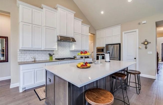 Plenty of cabinet space with pantry and mud room with additional refrigerator around the corner | Image 5