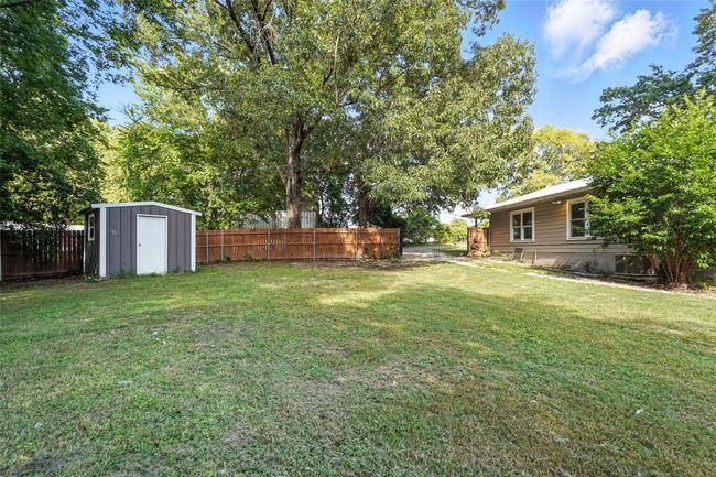 View of yard featuring a storage shed | Image 5