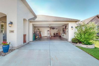 Garage featuring tandem golf cart space | Image 3