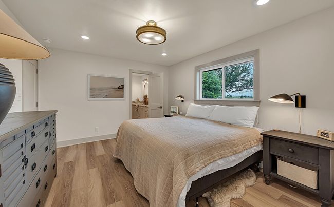Primary Bedroom with light wood-type flooring and recessed lighting | Image 25