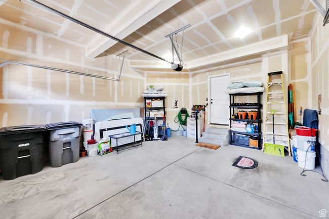 Garage with a garage door opener | Image 25