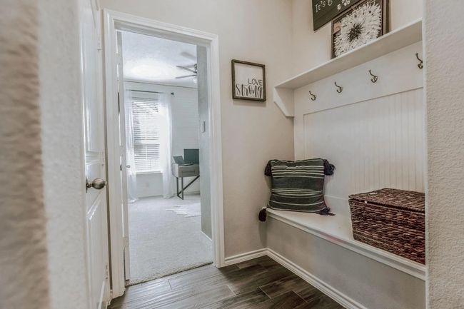 Mudroom featuring dark wood finished floors and baseboards | Image 15
