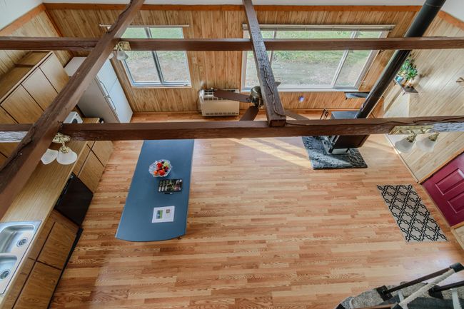 Interior details featuring hardwood / wood-style floors and wooden walls | Image 22