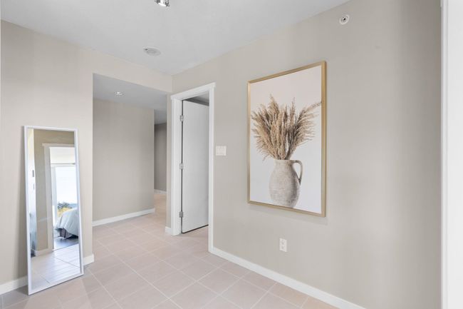 Empty room featuring baseboards and light tile patterned floors | Image 19