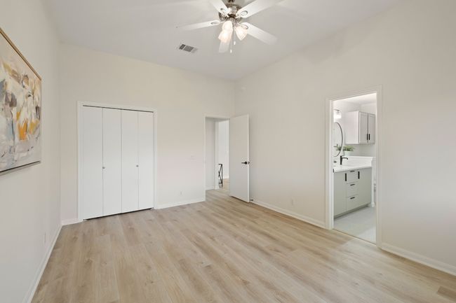 Primary suite has dual closets and easily fits a king size bed with room for multiple dressers | Image 10