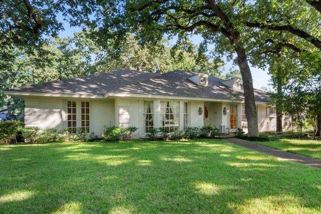 Single story home featuring a front yard, a shingled roof, and brick siding | Image 38