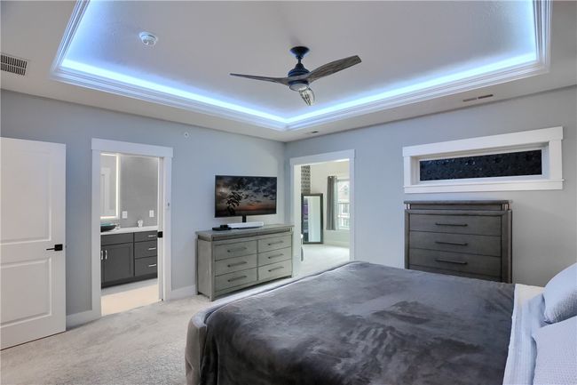 Transom light has a black out sticker on it but if you want the natural light to flood in from the private deck, sticker can be removed. Peek at the access to the second den/dressing room/flex space! | Image 30