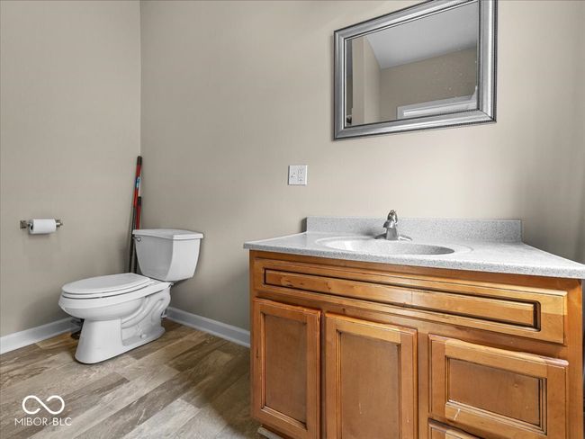 bathroom featuring vanity and wood finished floors | Image 21