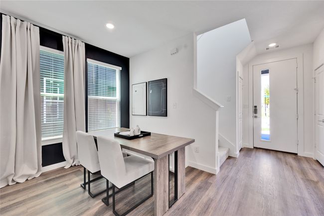 Dining space featuring stairs, recessed lighting, wood finished floors, and baseboards | Image 15