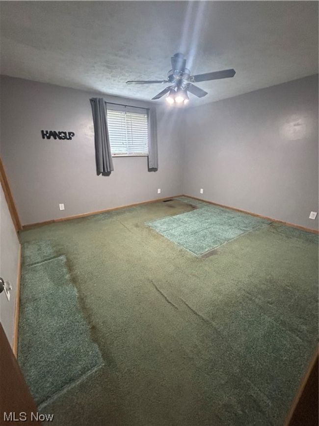 Empty room featuring carpet floors and ceiling fan | Image 11