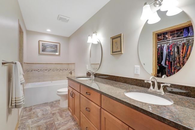 Owner's bathroom includes 2 sinks, and the same beautiful cabinets and countertops as kitchen! | Image 25