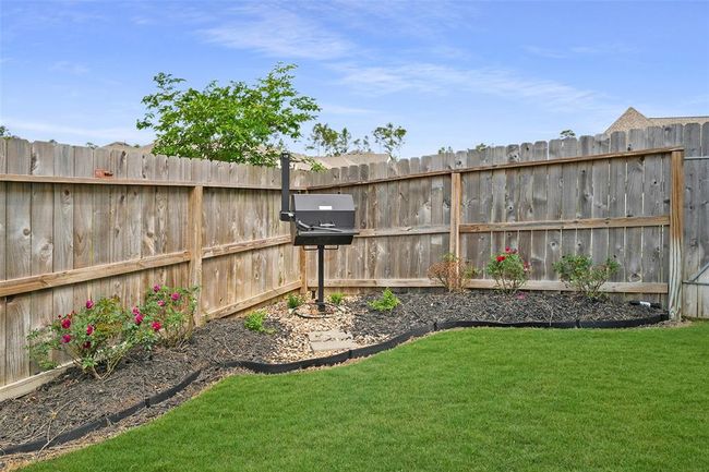 Enjoy outdoor cooking with a versatile wood or coal BBQ, perfect for gatherings in your backyard oasis. | Image 37