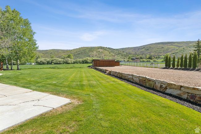 View of yard featuring a mountain view, a view of countryside, and an outbuilding | Image 58