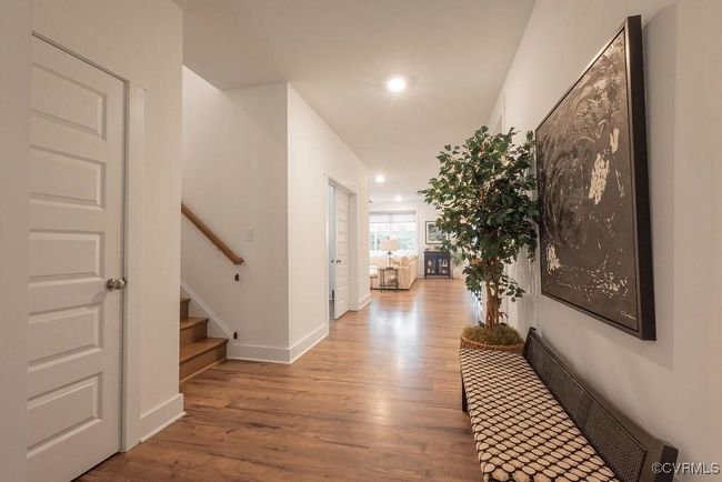 Corridor with wood finished floors, stairway, and recessed lighting | Image 6