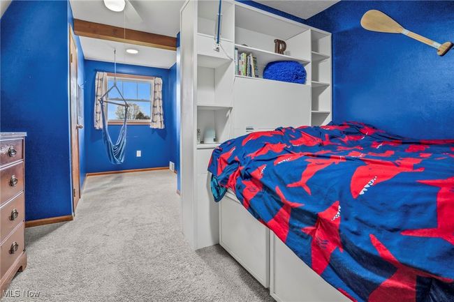 Carpeted bedroom with baseboards | Image 26