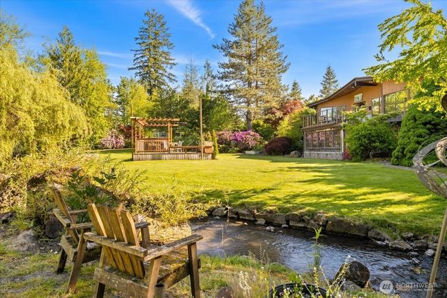Stunning and lush landscape surround you at this Twin Creeks Estate. | Image 29