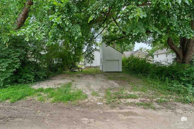 Owner is to gravel the parking area to the fence from the alley. | Image 31