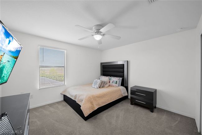 Bedroom featuring carpet floors and ceiling fan | Image 37