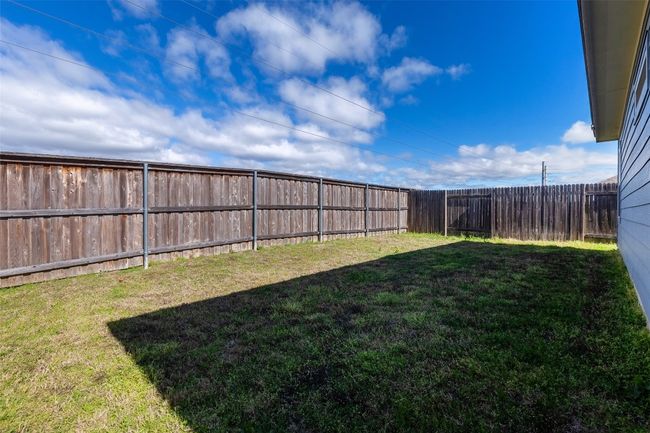 View of yard with a fenced backyard | Image 32