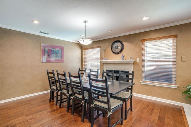 Dining Area or Optional Den with Wood Burning Fireplace | Image 14