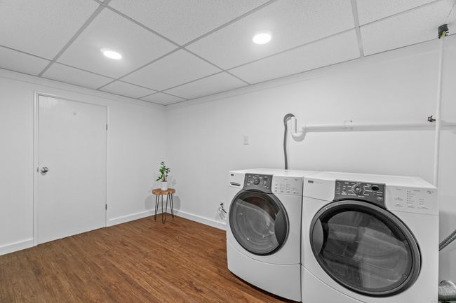 Updated laundry room with space for storage | Image 32