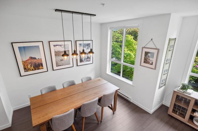 Dining room featuring dark wood-type flooring, baseboards, and baseboard heating | Image 18