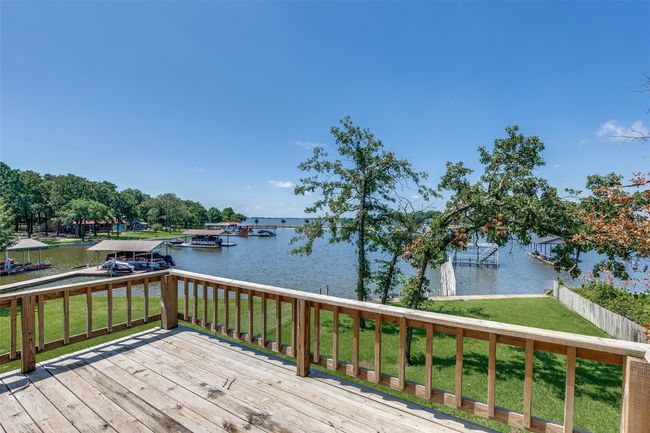 Wooden terrace featuring a water view, a yard, and a dock | Image 19