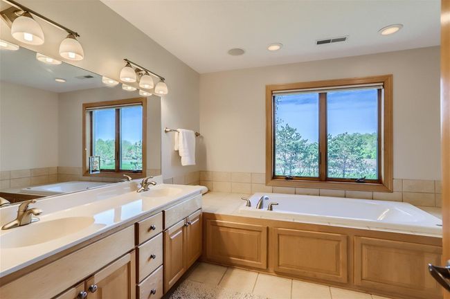 Dual sinks & a whirlpool tub are also found in the Ensuite. | Image 17