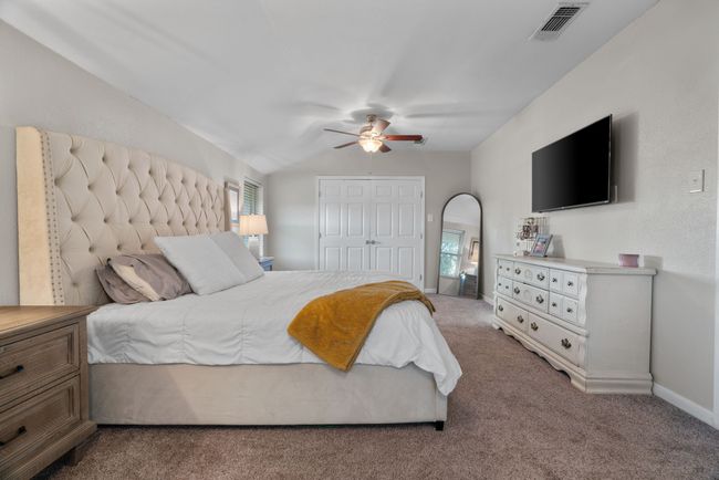 Bedroom with carpet, a closet, and ceiling fan | Image 24
