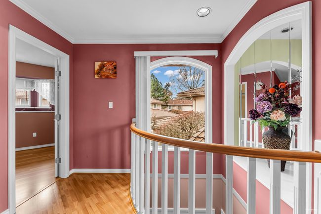 Hall featuring light wood-type flooring, crown molding, and baseboards | Image 13