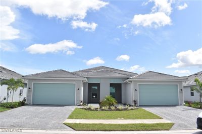 View of front of house featuring a garage | Image 1