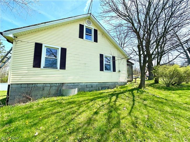 View of home's exterior featuring a lawn | Image 23