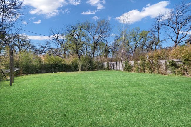 Large fenced in backyard | Image 33