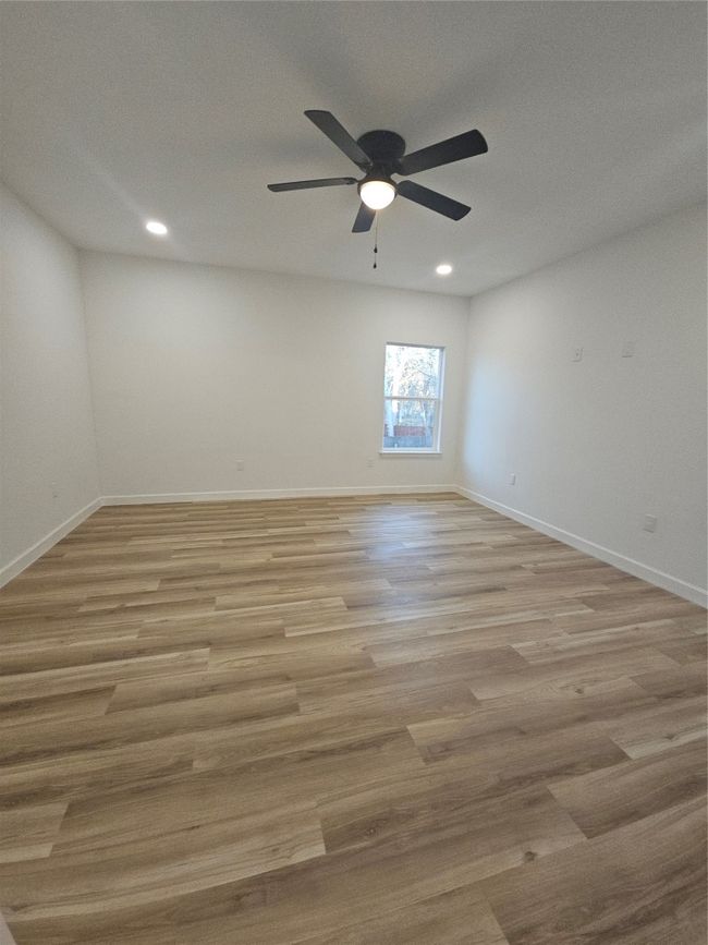 Spare room with a ceiling fan, recessed lighting, light wood-style floors, and baseboards | Image 9