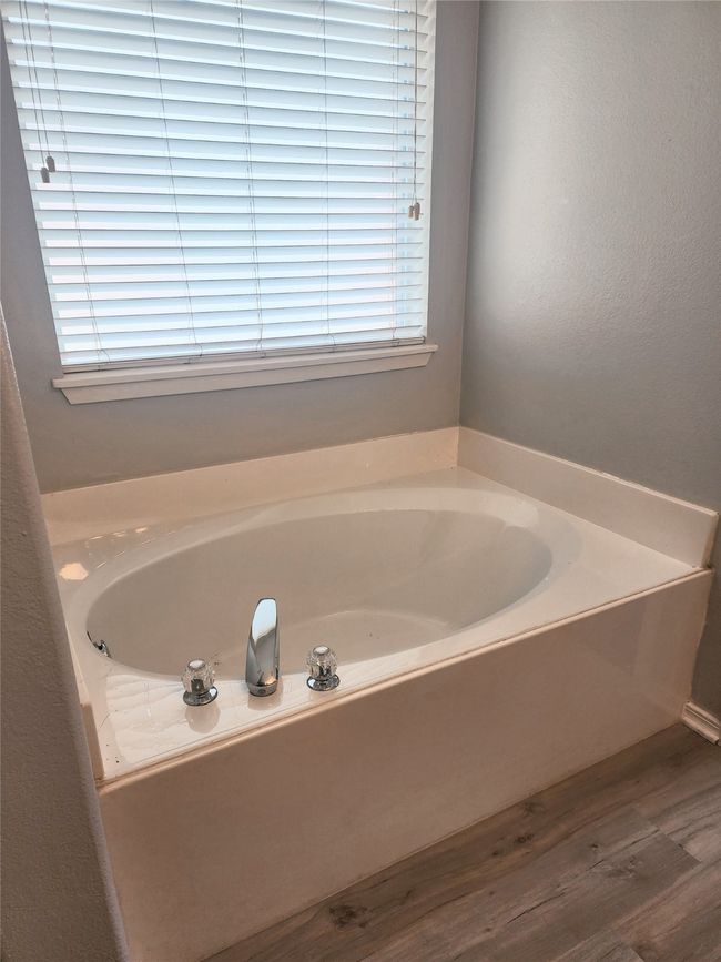 Bathroom featuring bathtub | Image 18