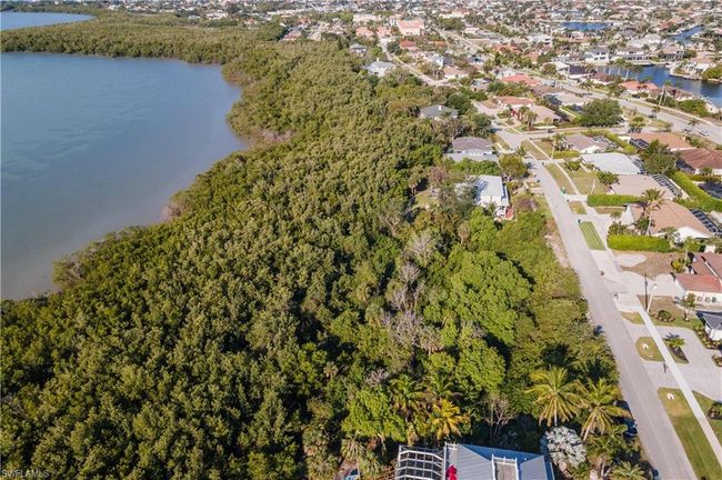 Drone / aerial view featuring a water view and a residential view | Image 9