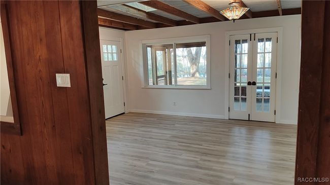 through living room to french doors to screen porch | Image 27