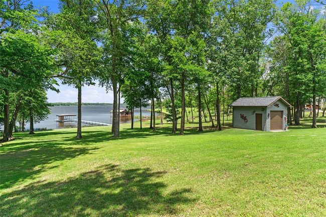 View of yard with a water view and an outdoor structure | Image 32