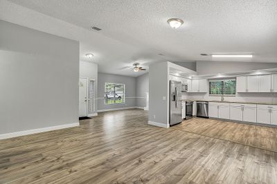 Living room features cozy fireplace | Image 2